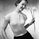15th January 1953: Fine patterned rib cardigan with cap sleeves, pearl buttons to a round neck and a deep, ribbed welt. (Photo by Chaloner Woods/Getty Images)